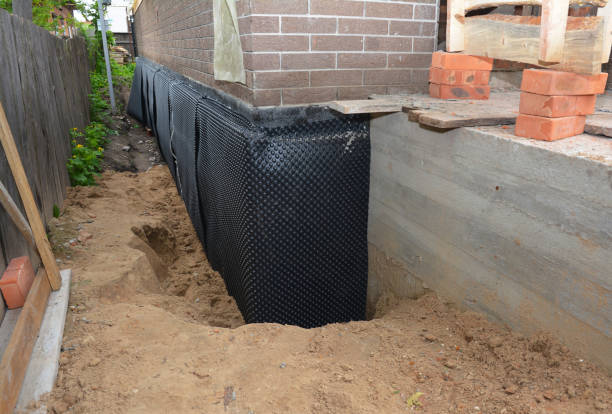 Happy homeowners after waterproofing job in Chaska